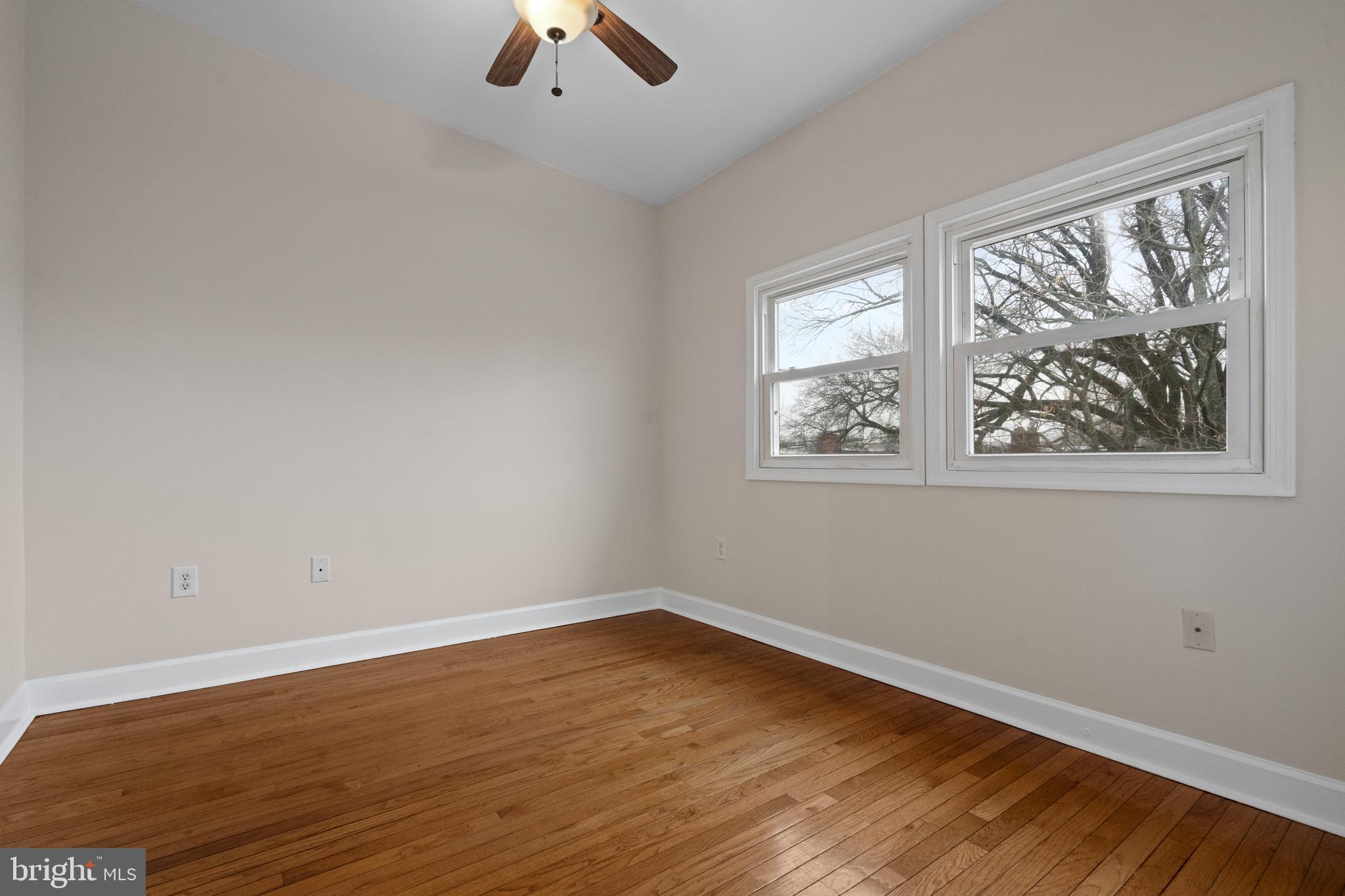 1909 Rosedale Street Northeast, Unit 3 Washington, DC 20002 - Photo 13 of 23 a view of empty room with wooden floor and fan