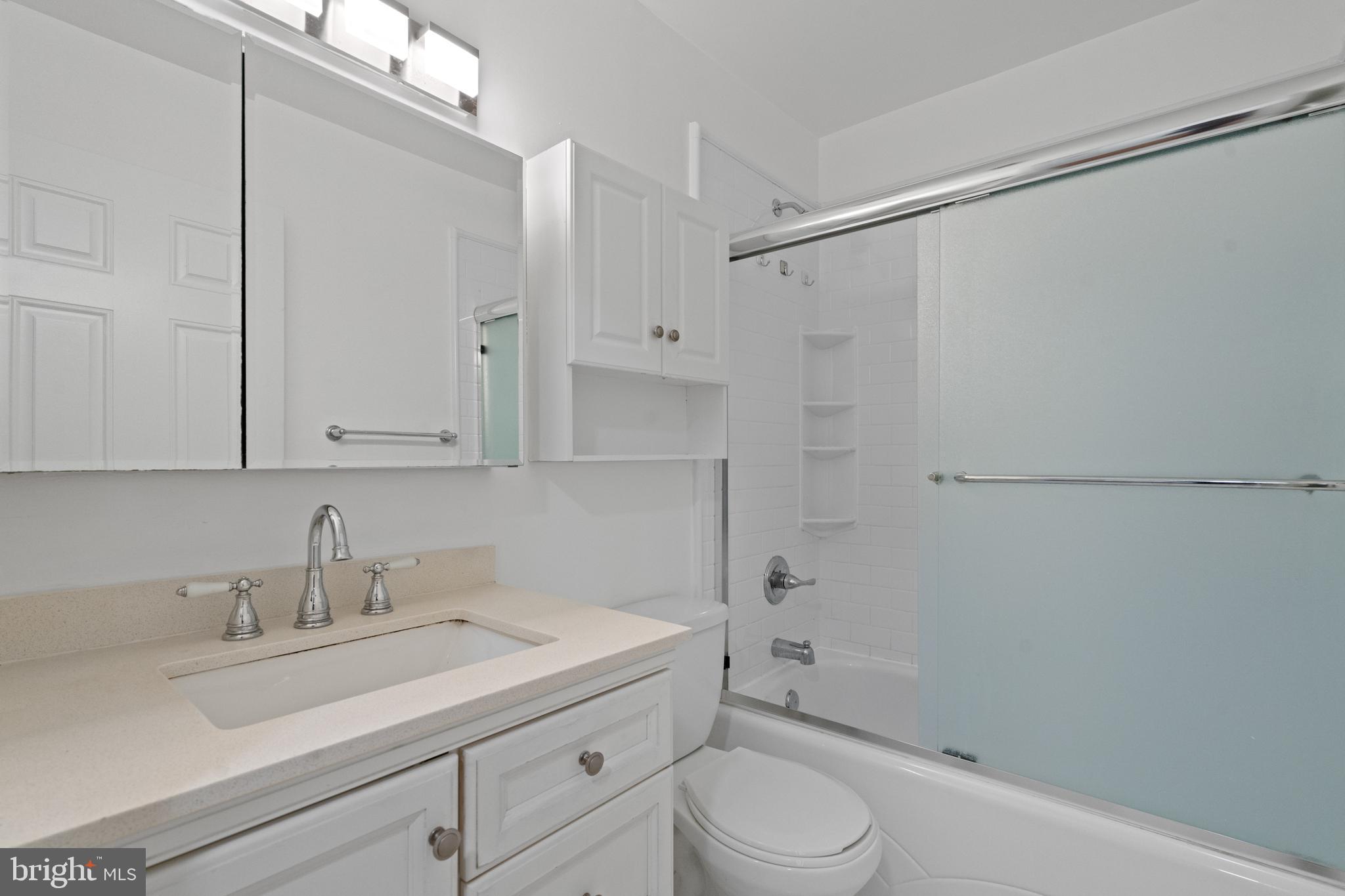 1909 Rosedale Street Northeast, Unit 3 Washington, DC 20002 - Photo 7 of 23 a bathroom with a sink a toilet and shower