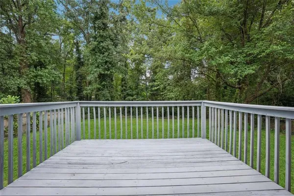 a view of balcony with wooden floor