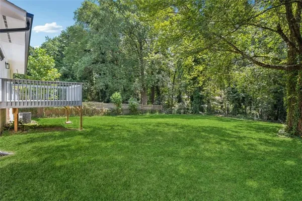 a view of green field with sitting area