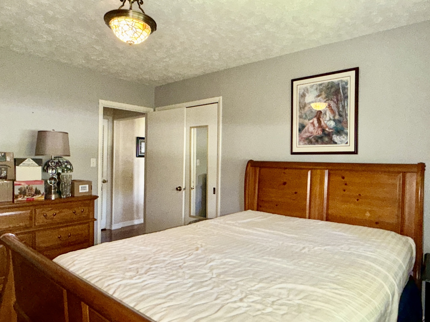 956 Country Club Road Metropolis, IL 62960 - Photo 21 of 48 a bedroom with a bed and a dresser