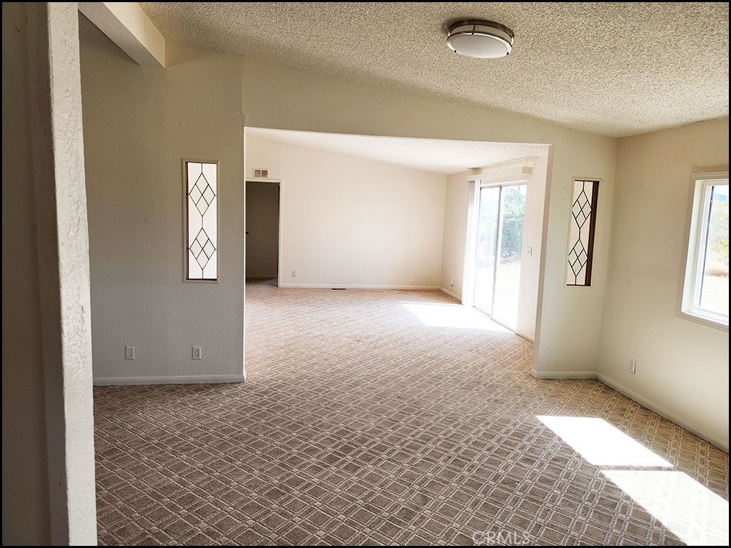 12232 Sheep Creek Road Phelan, CA 92371 - Photo 18 of 45 an empty room with windows