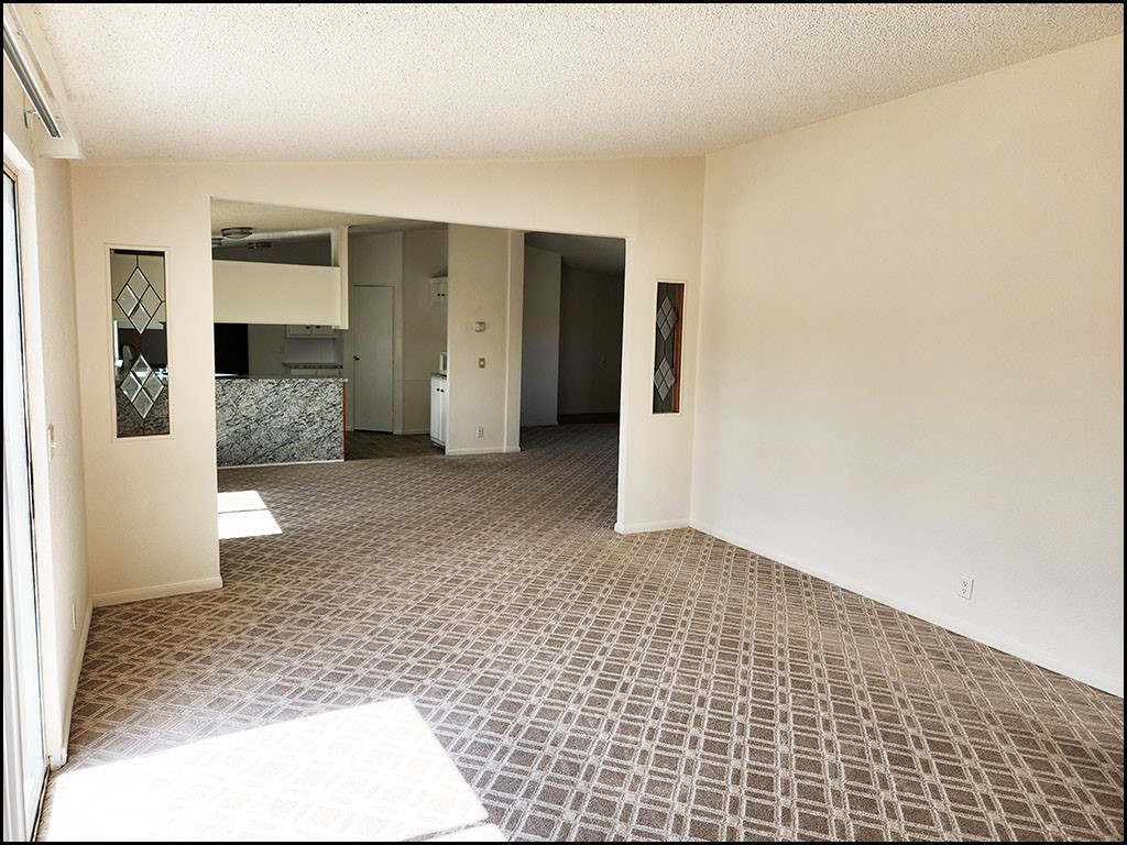 12232 Sheep Creek Road Phelan, CA 92371 - Photo 19 of 45 a view of livingroom with an empty space and window