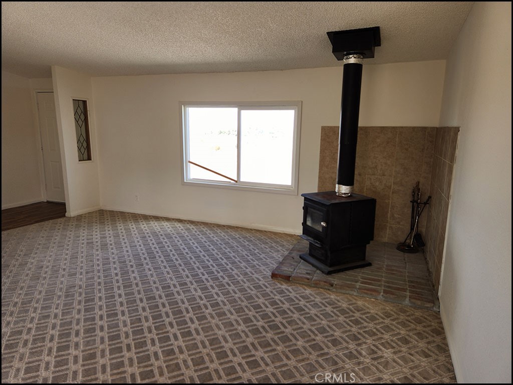 12232 Sheep Creek Road Phelan, CA 92371 - Photo 21 of 45 a room with a couch