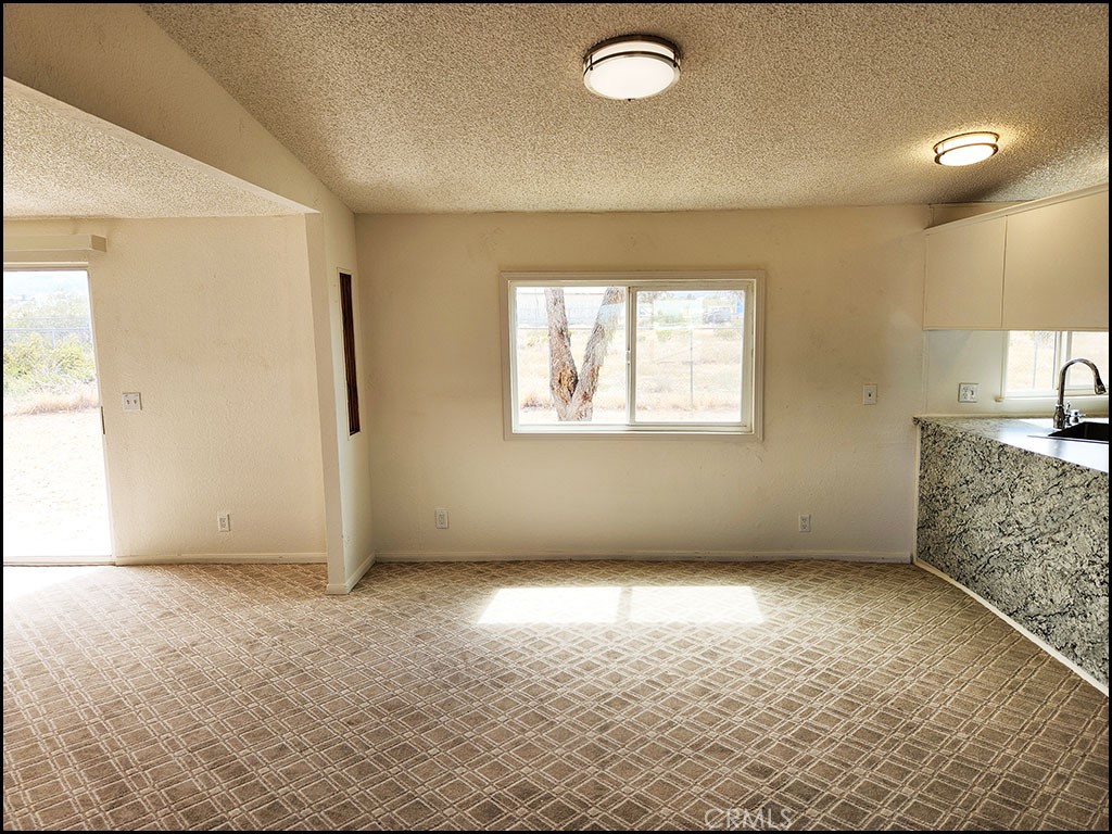 12232 Sheep Creek Road Phelan, CA 92371 - Photo 22 of 45 an empty room with windows