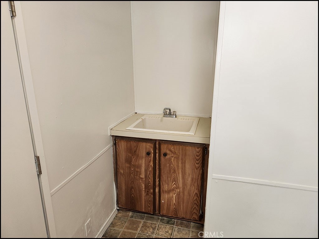 12232 Sheep Creek Road Phelan, CA 92371 - Photo 27 of 45 a bathroom with a sink and a mirror