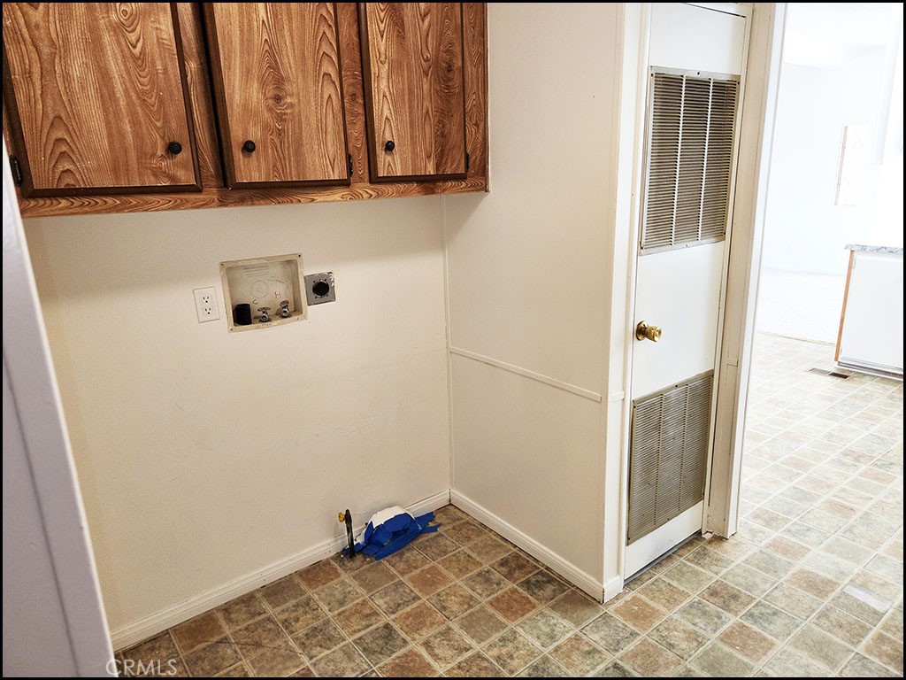 12232 Sheep Creek Road Phelan, CA 92371 - Photo 28 of 45 a view of a utility room with cabinets