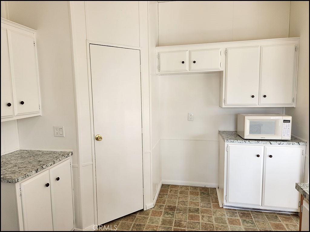 12232 Sheep Creek Road Phelan, CA 92371 - Photo 29 of 45 a view of cabinets with wooden floor