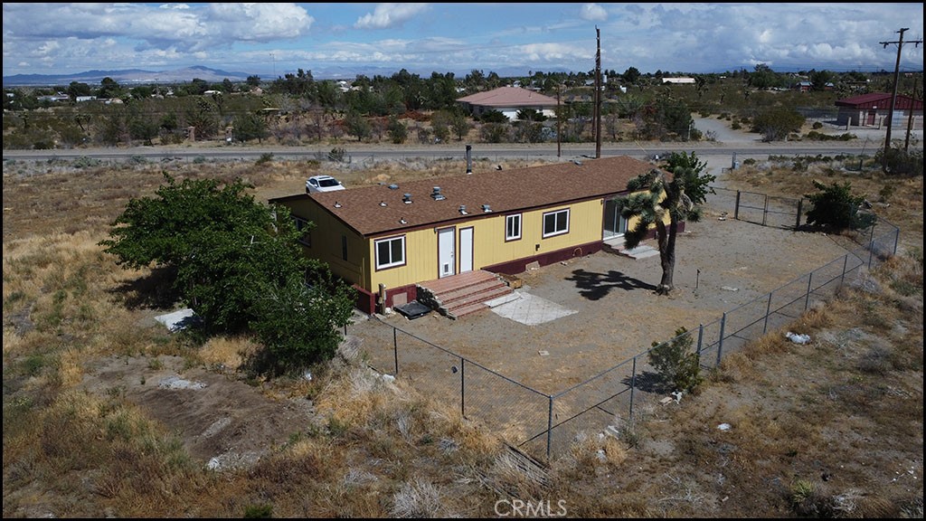 12232 Sheep Creek Road Phelan, CA 92371 - Photo 3 of 45 an aerial view of a house with a yard