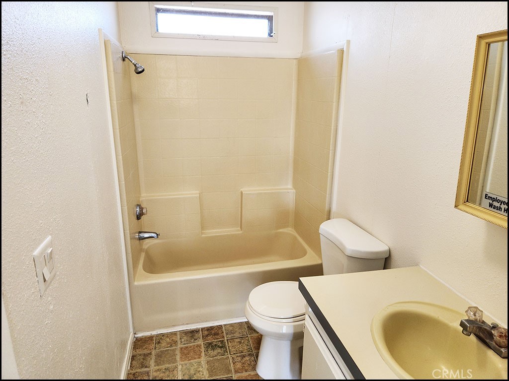 12232 Sheep Creek Road Phelan, CA 92371 - Photo 32 of 45 a bathroom with a sink and a toilet