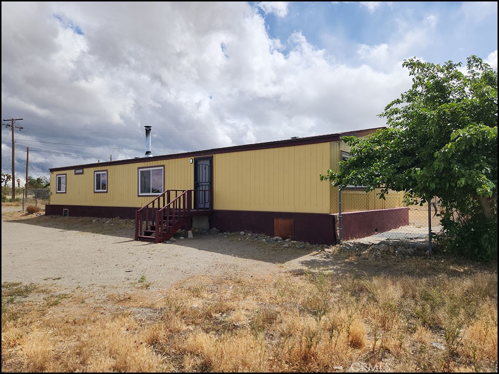 12232 Sheep Creek Road Phelan, CA 92371 - Photo 34 of 45 a view of a house with a snow in the yard