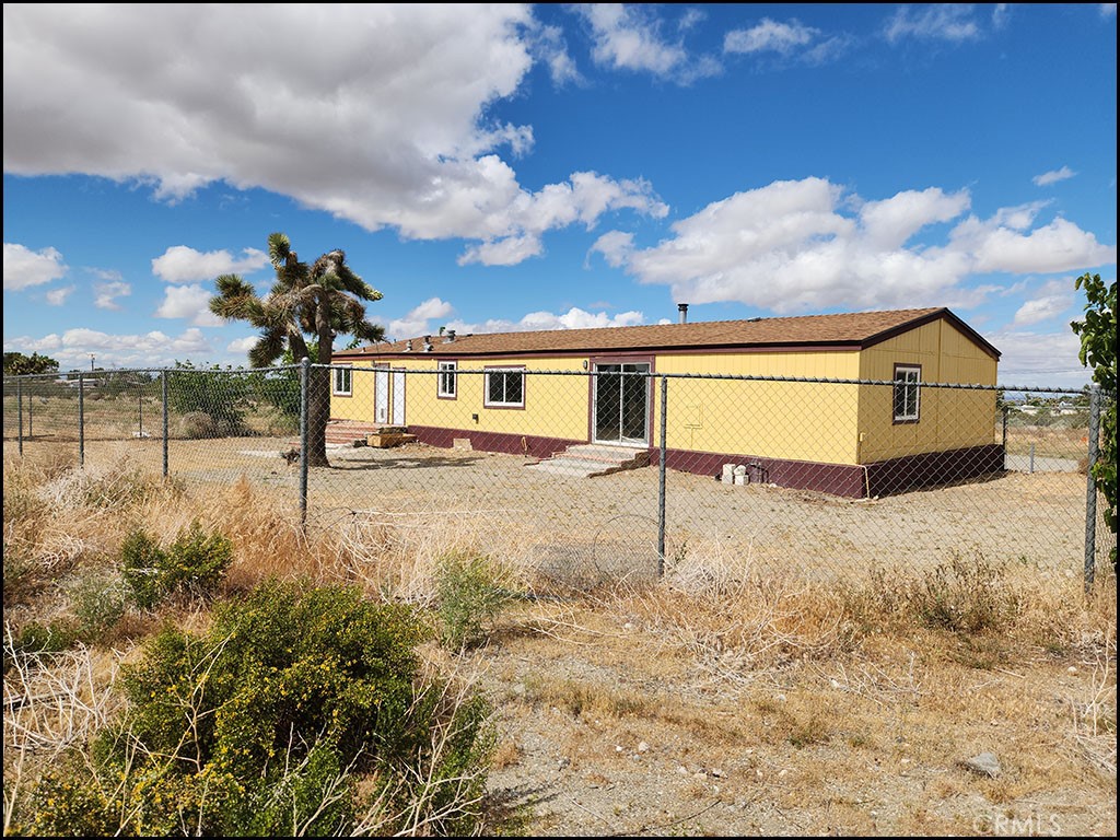12232 Sheep Creek Road Phelan, CA 92371 - Photo 36 of 45 a view of a house with a yard