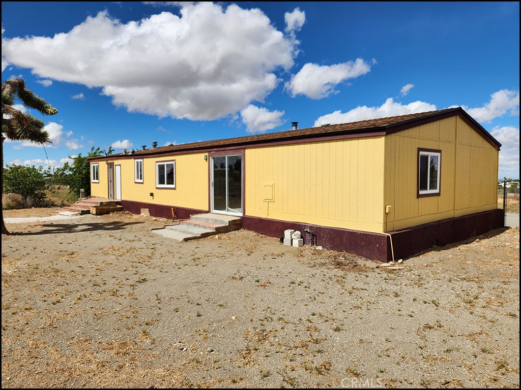 12232 Sheep Creek Road Phelan, CA 92371 - Photo 37 of 45 a view of a backyard of a house