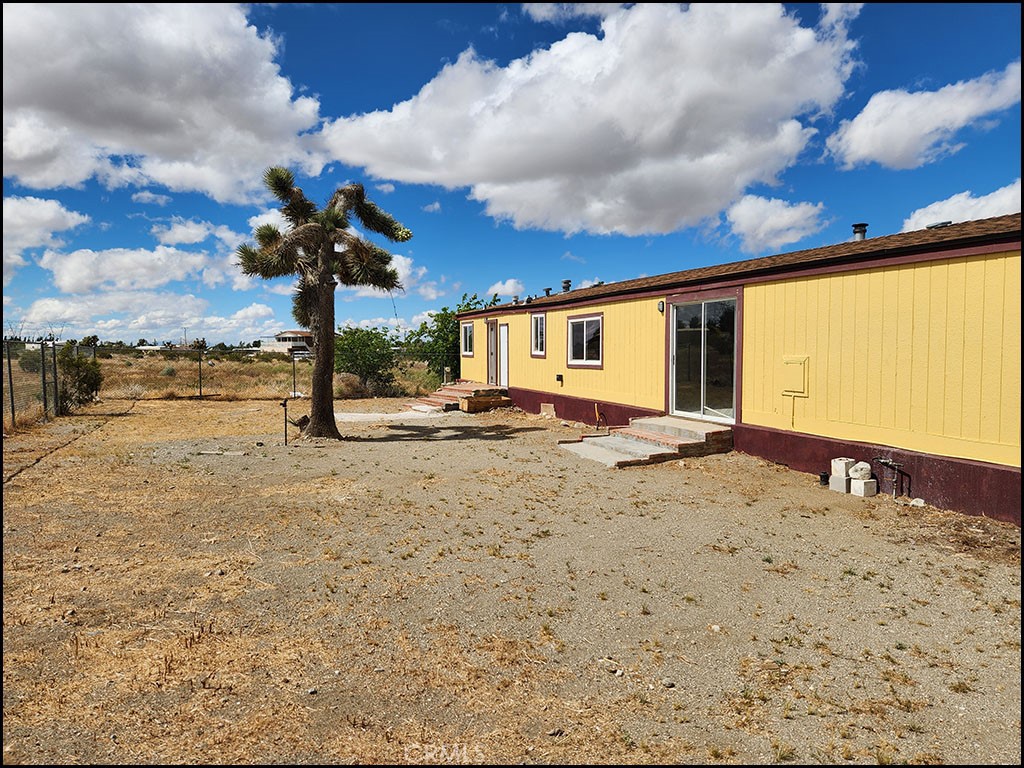 12232 Sheep Creek Road Phelan, CA 92371 - Photo 38 of 45 a view of a backyard of the house
