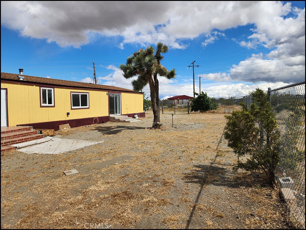 12232 Sheep Creek Road Phelan, CA 92371 - Photo 39 of 45 a view of a house with a yard