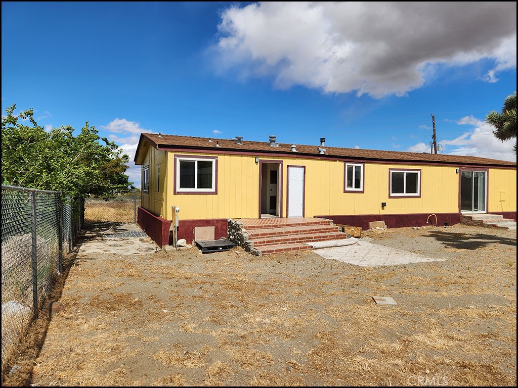 12232 Sheep Creek Road Phelan, CA 92371 - Photo 40 of 45 a view of a house with backyard and sitting area