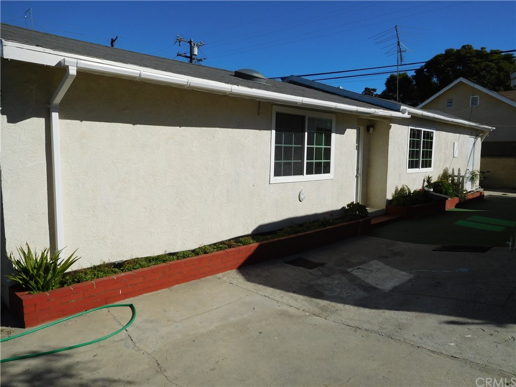 15022 McRae Avenue Norwalk, CA 90650 - Photo 4 of 28 a front view of a house with a yard