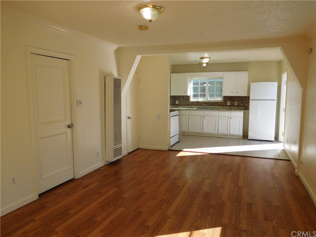 15022 McRae Avenue Norwalk, CA 90650 - Photo 9 of 28 a view of a kitchen with a sink and a refrigerator