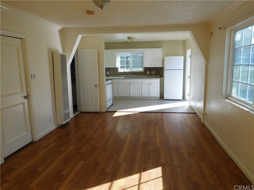 15022 McRae Avenue Norwalk, CA 90650 - Photo 10 of 28 a view of a kitchen cabinets and wooden floor