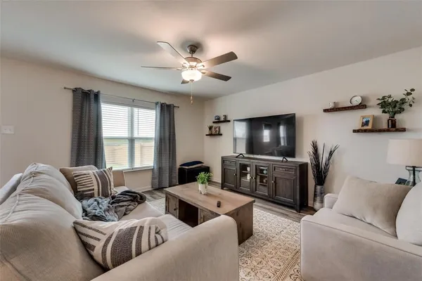 a living room with furniture and a flat screen tv