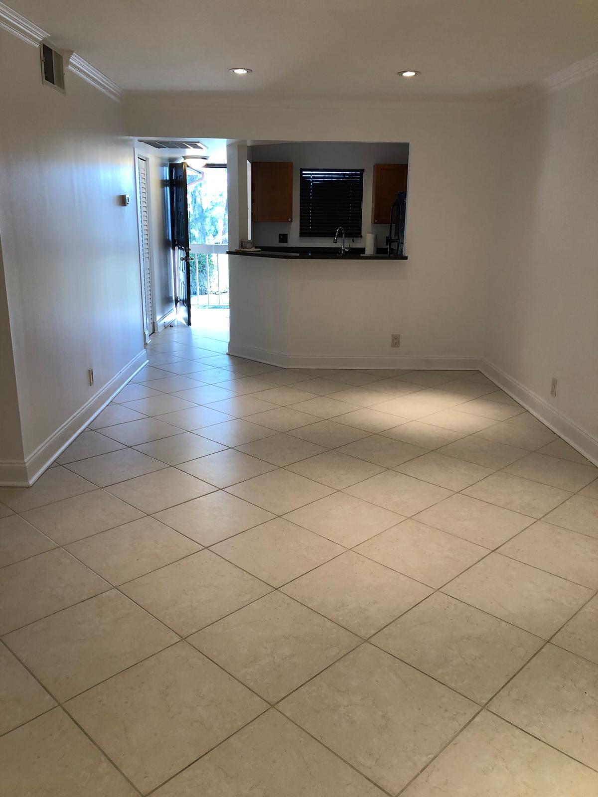 21911 Lake Forest Circle, Unit 204 Boca Raton, FL 33433 - Photo 15 of 16 a view of a living room washer and dryer