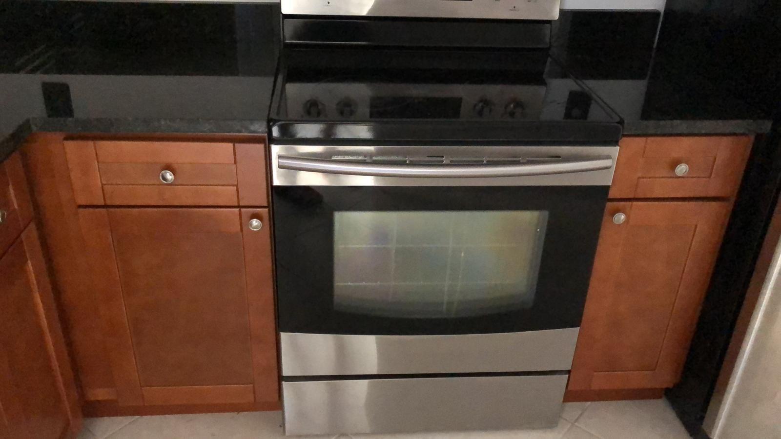 21911 Lake Forest Circle, Unit 204 Boca Raton, FL 33433 - Photo 8 of 16 a view of washer and dryer