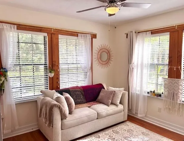 a living room with furniture and a window