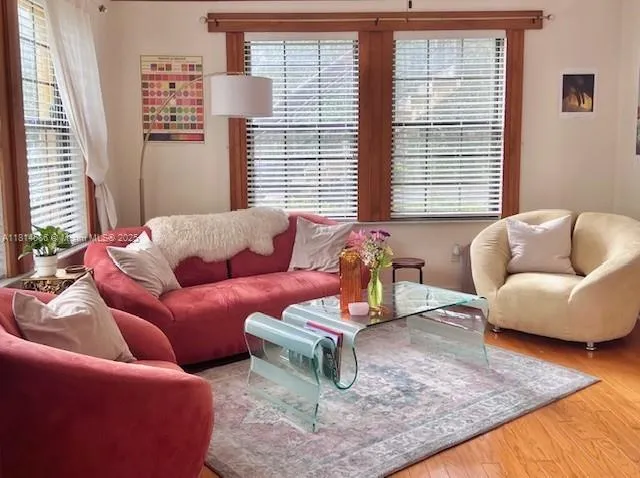 a living room with furniture and a large window