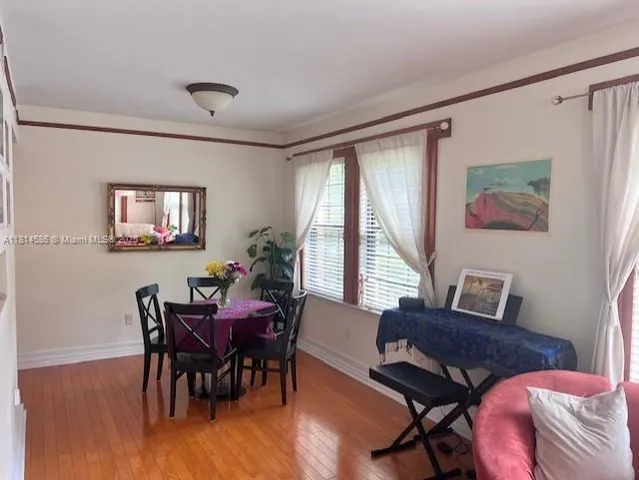 a view of a livingroom with furniture and a window