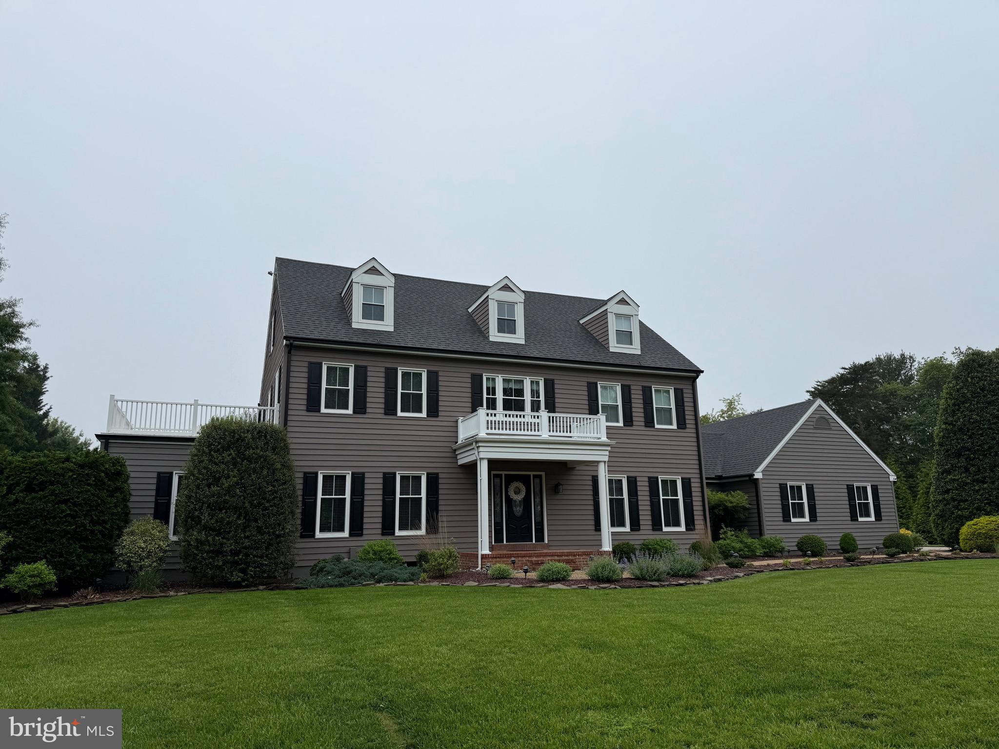 2032 Windswept Drive Dover, DE 19901 - Photo 1 of 2 a front view of a house with a garden