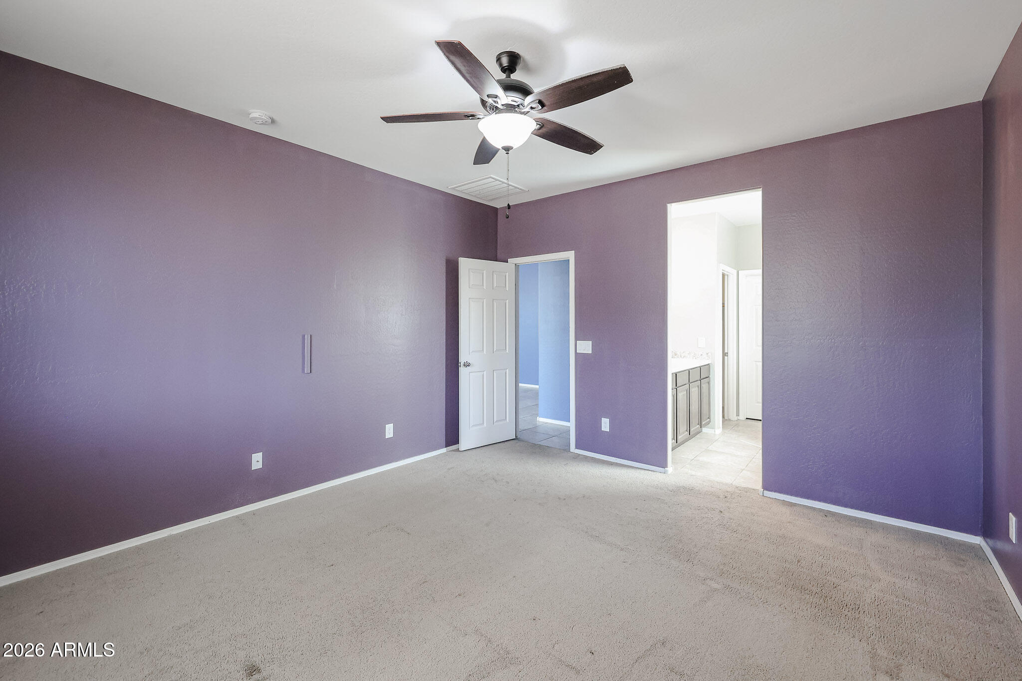 11967 West Rio Vista Lane Avondale, AZ 85323 - Photo 15 of 28 a view of an empty room with a ceiling fan