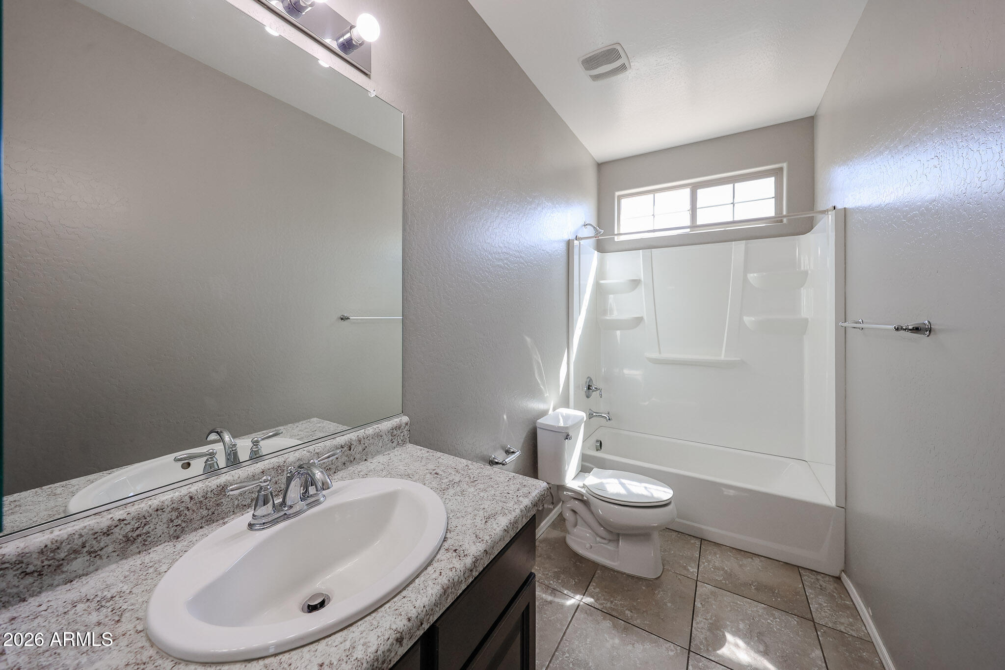 11967 West Rio Vista Lane Avondale, AZ 85323 - Photo 18 of 28 a bathroom with a sink toilet and shower