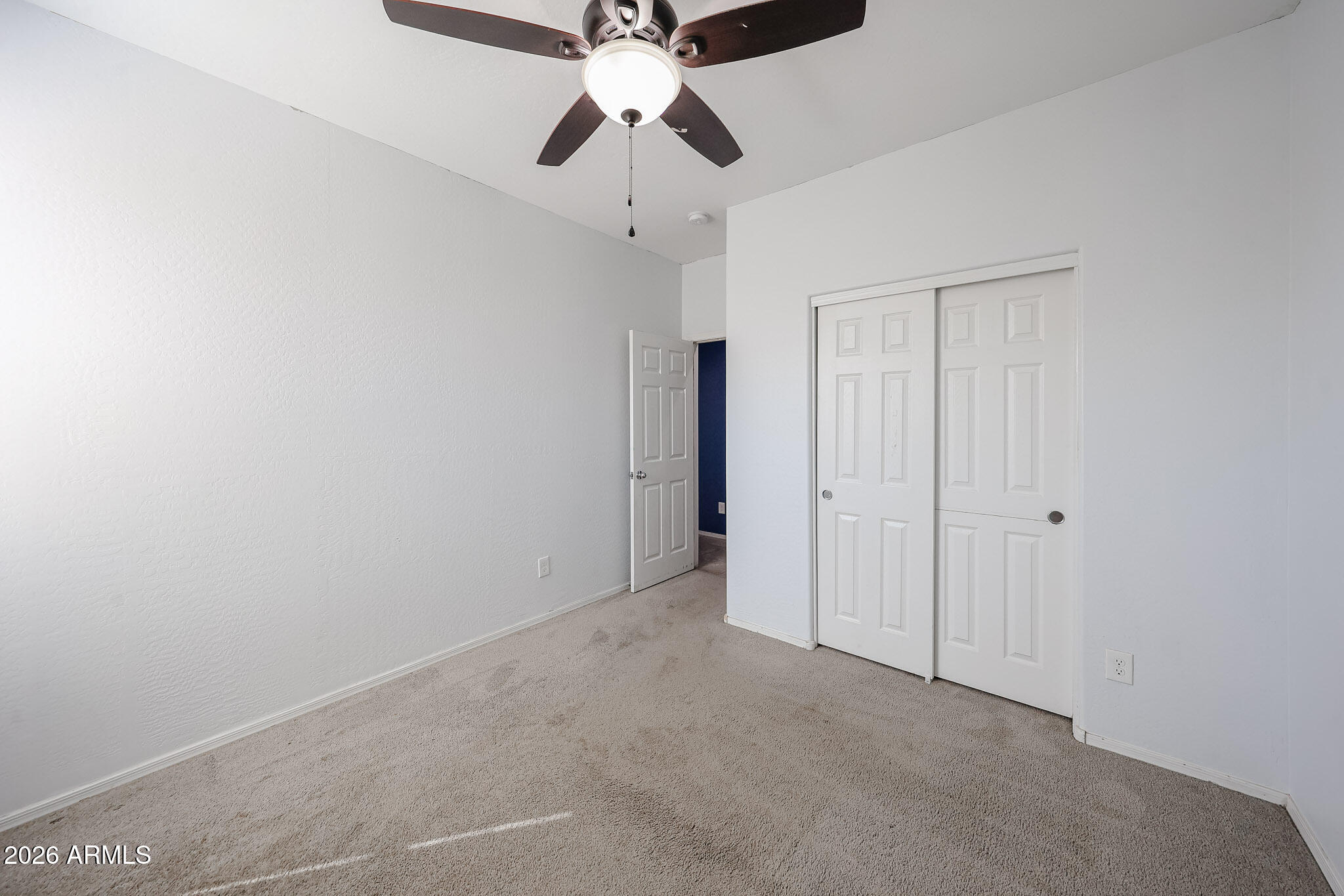 11967 West Rio Vista Lane Avondale, AZ 85323 - Photo 19 of 28 a view of an empty room and chandelier fan