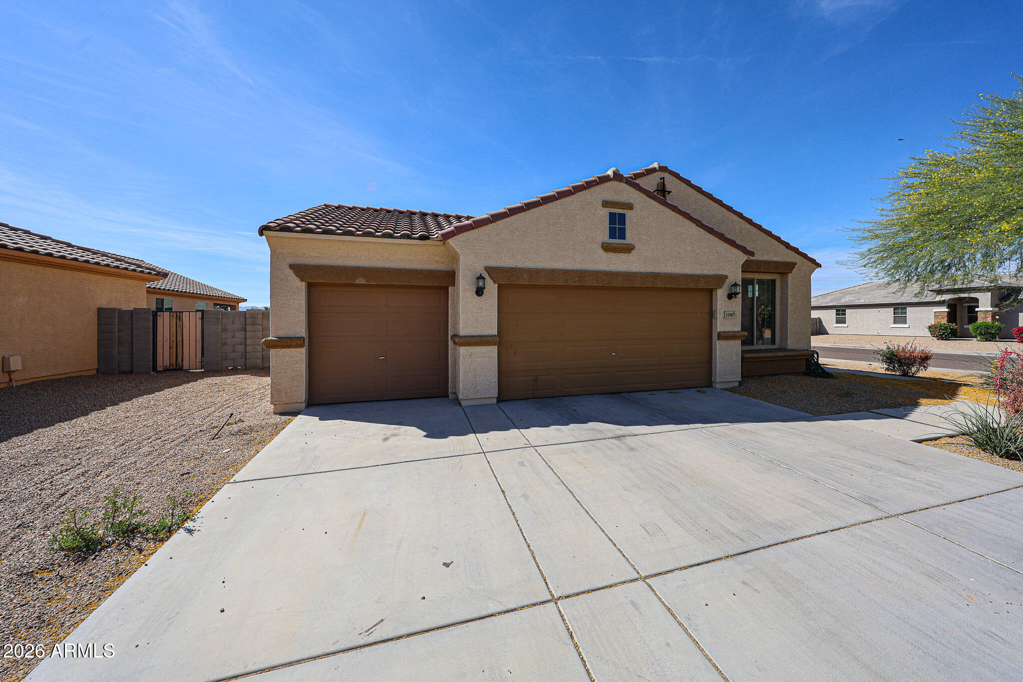 11967 West Rio Vista Lane Avondale, AZ 85323 - Photo 2 of 28 a front view of a house with a garage