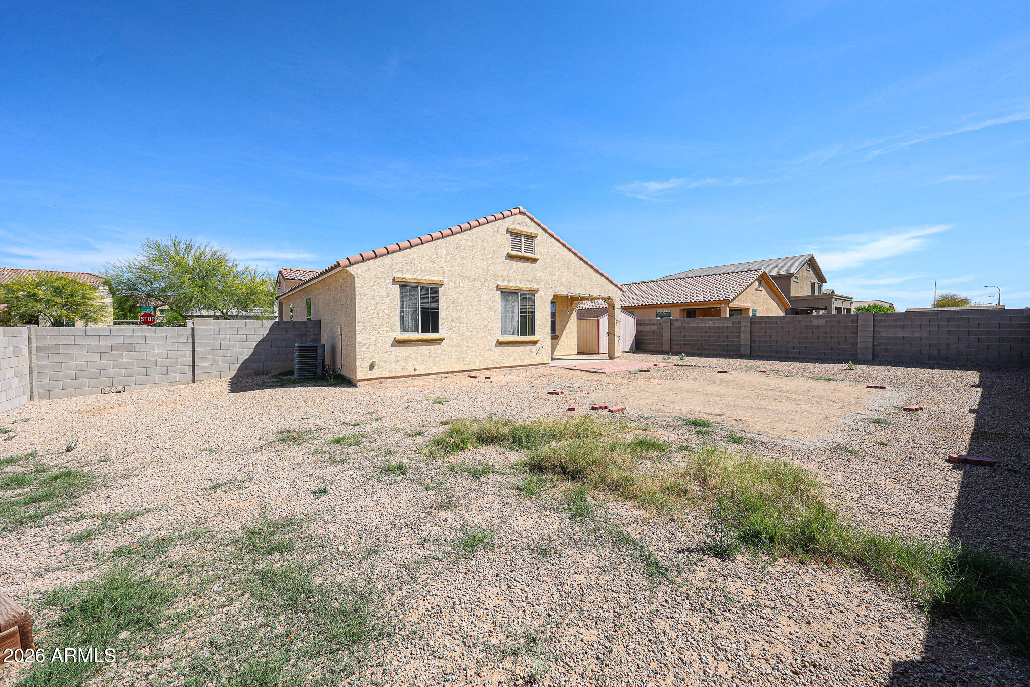 11967 West Rio Vista Lane Avondale, AZ 85323 - Photo 27 of 28 a front view of a house with a yard