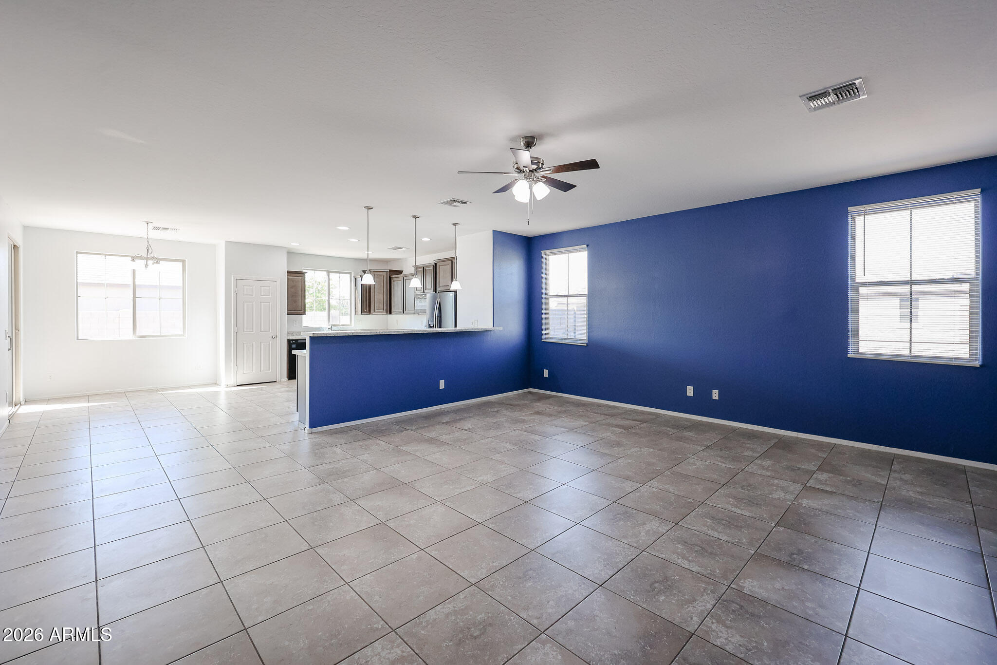 11967 West Rio Vista Lane Avondale, AZ 85323 - Photo 4 of 28 a view of an empty room with windows