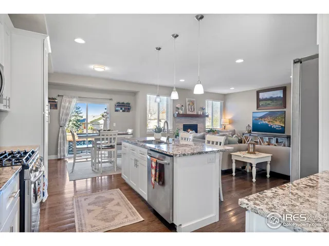 a kitchen with lots of counter top space and furniture