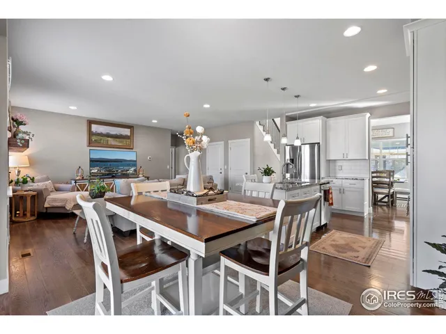 a dining room with a table and chairs
