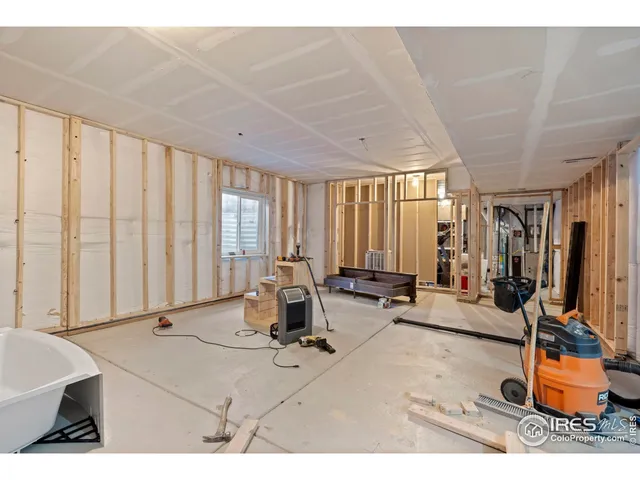 a living room with furniture a large window