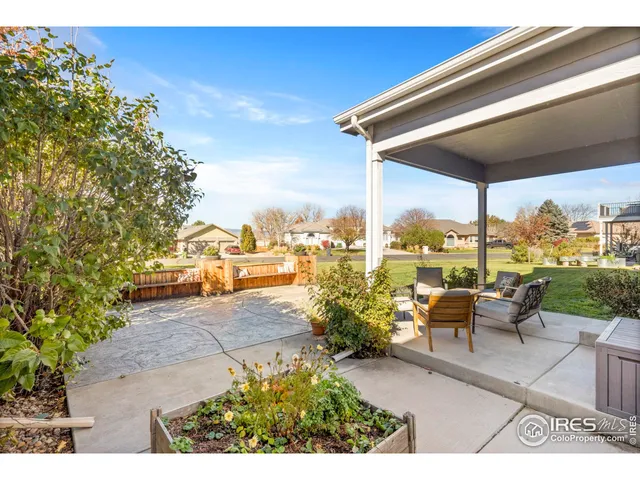 a terrace with outdoor seating and city view