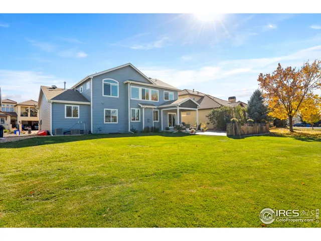 a house view with swimming pool in front of it