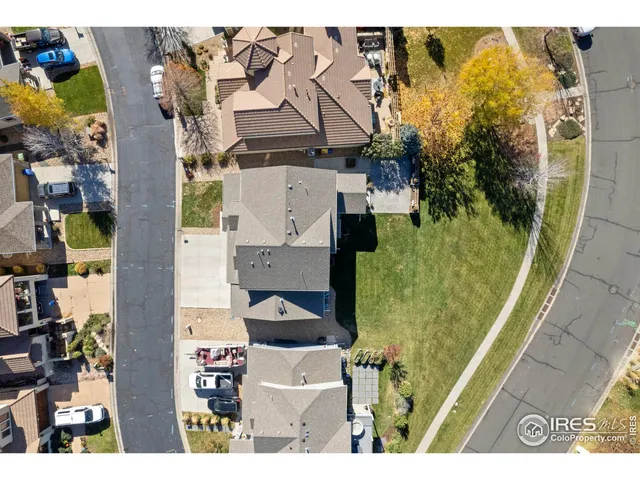 an aerial view of residential house with outdoor space and swimming pool