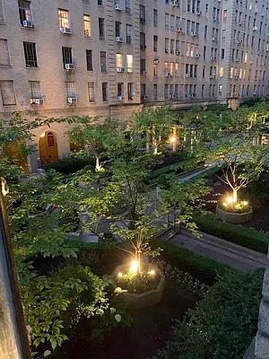 333 West 56th Street, Unit 2N Manhattan, NY 10019 - Photo 5 of 8 a view of building with yard