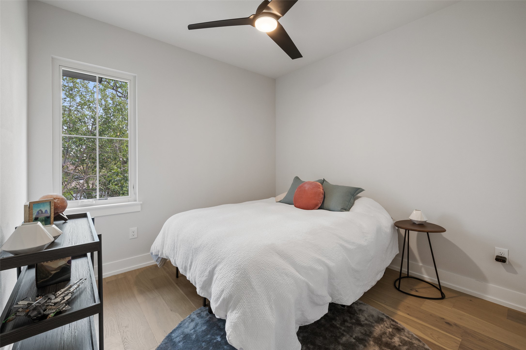1504 Ruth Avenue, Unit 3 Austin, TX 78757 - Photo 27 of 39 Hardwood floors and a large window illuminate this airy bedroom.