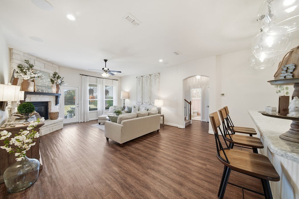 9614 Carson Lane Iowa Colony, TX 77583 - Photo 11 of 50 This layout is perfection! Living room, kitchen connected, 2 bedrooms and full bath through the archway! See the staircase? The game/family room, media room and half bath are conveniently located upstairs!
