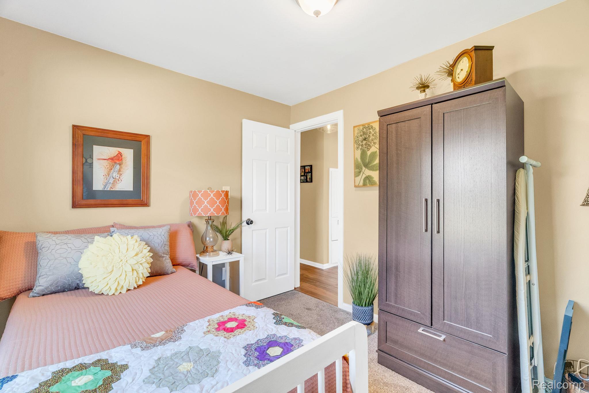 1020 Capac Road Allenton, MI 48002 - Photo 22 of 36 Bedroom featuring light colored carpet and baseboards