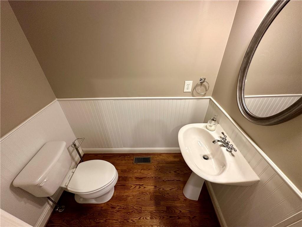 1615 Rivers Edge Trail Northeast Atlanta, GA 30324 - Photo 9 of 26 a bathroom with a sink mirror and toilet