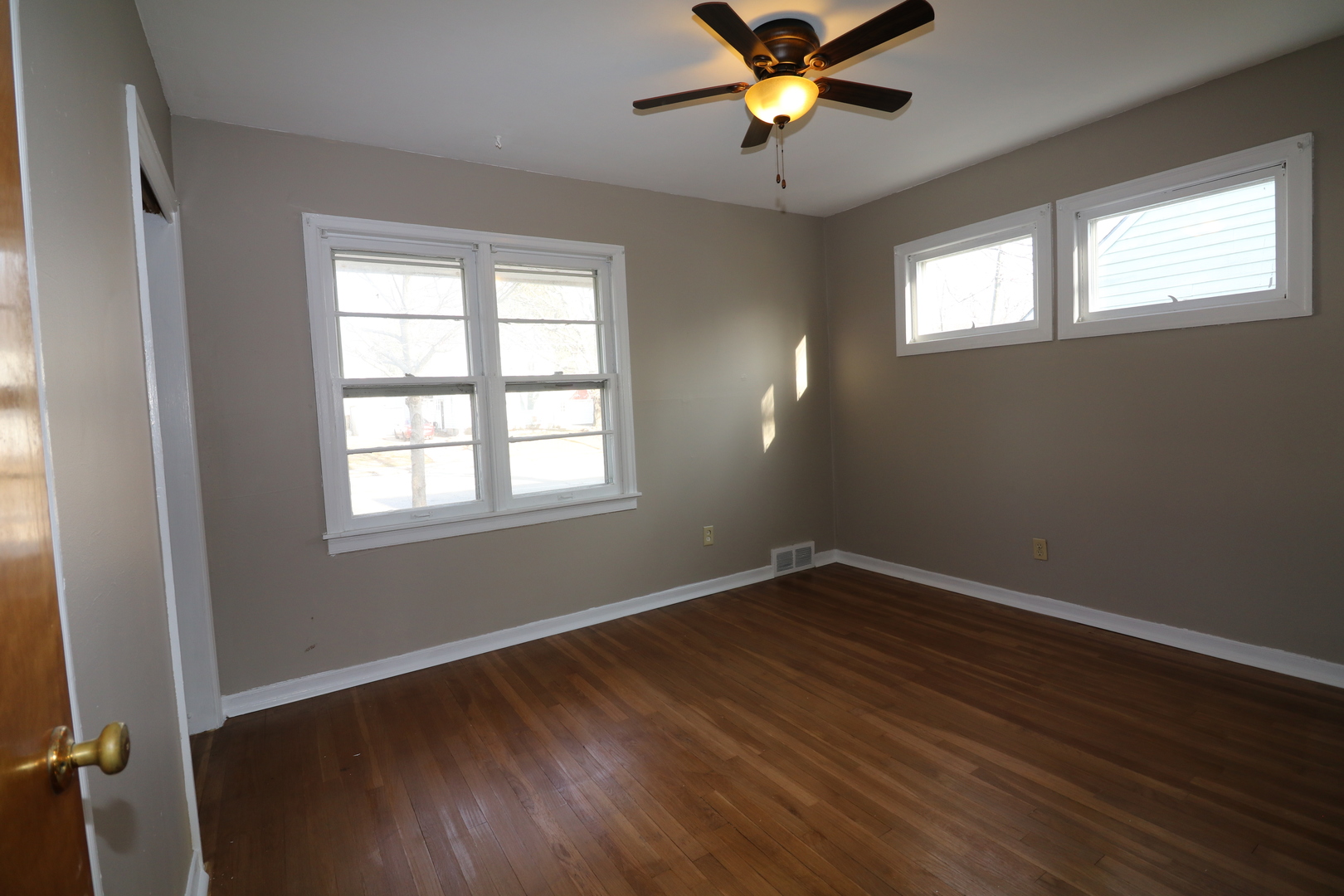 1307 South Jasper Street Decatur, IL 62521 - Photo 6 of 16 a view of a room with wooden floor and windows