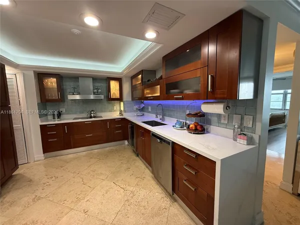 a kitchen with a refrigerator and a refrigerator