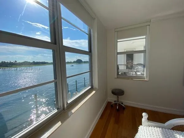 a bedroom with a bed and a ceiling fan